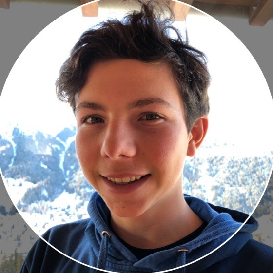 A person smiling for the camera

Description automatically generated