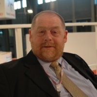 A person wearing a suit and tie

Description automatically generated