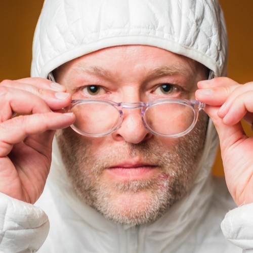 A person wearing a hat and glasses

Description automatically generated