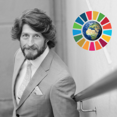 A person standing posing for the camera

Description automatically generated