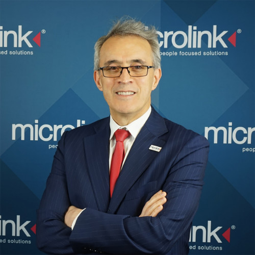 A person wearing a suit and tie

Description automatically generated