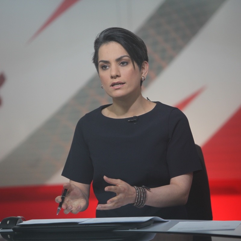 A person standing in front of a computer

Description automatically generated